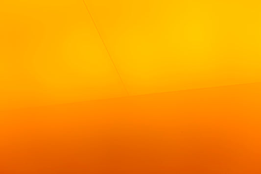a yellow wall with a clock on it