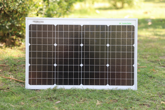 white and black board on green grass during daytime