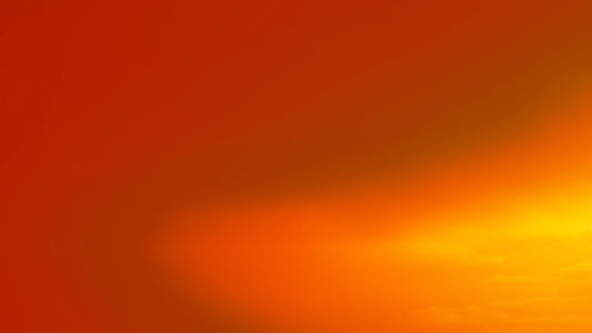 a red and yellow background with a plane flying in the sky