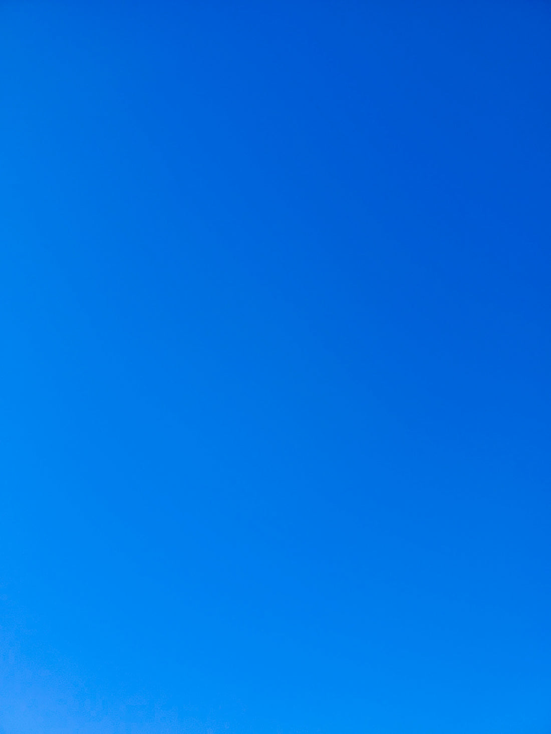 a group of people standing on top of a snow covered slope