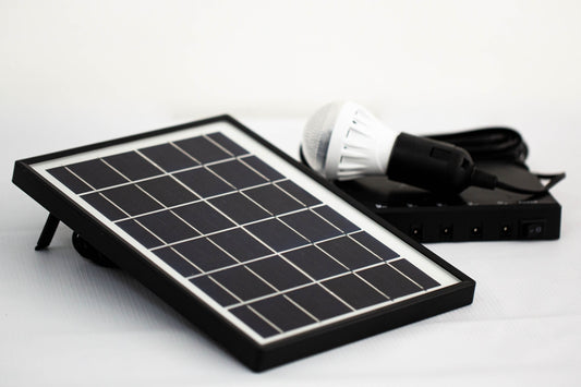 a solar panel with a light bulb on top of it
