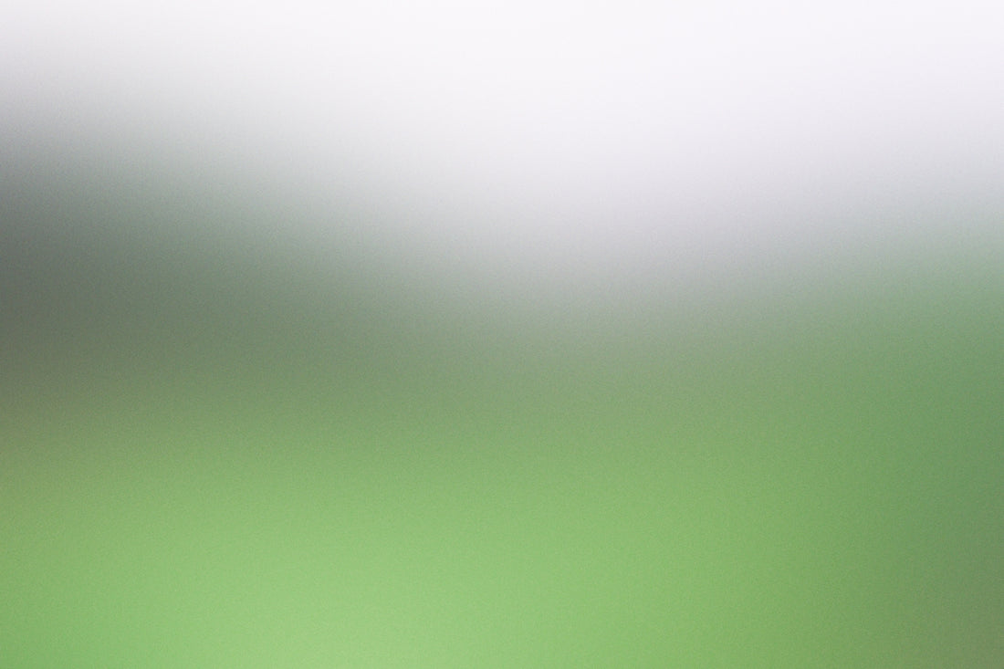 a blurry image of a green and white background