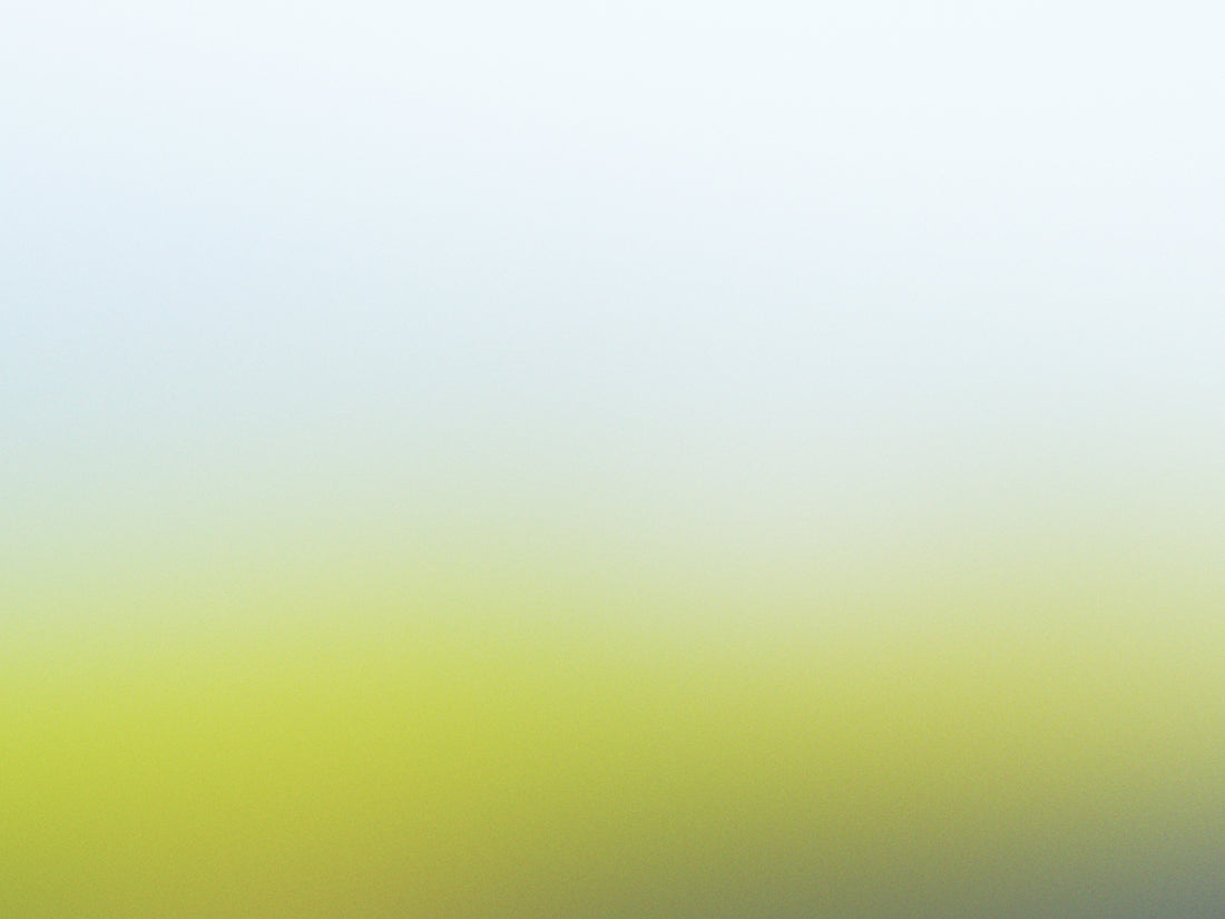 a blurry image of a green and yellow background