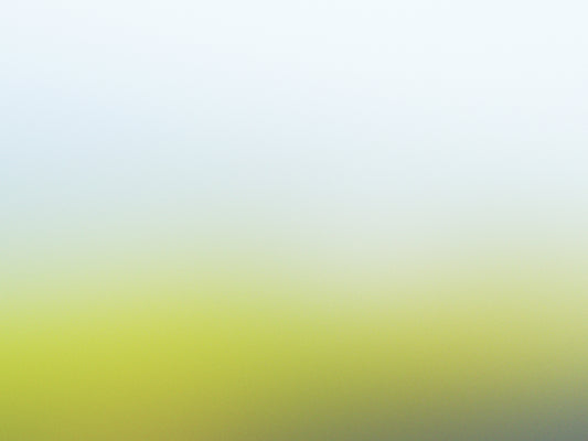 a blurry image of a green and yellow background