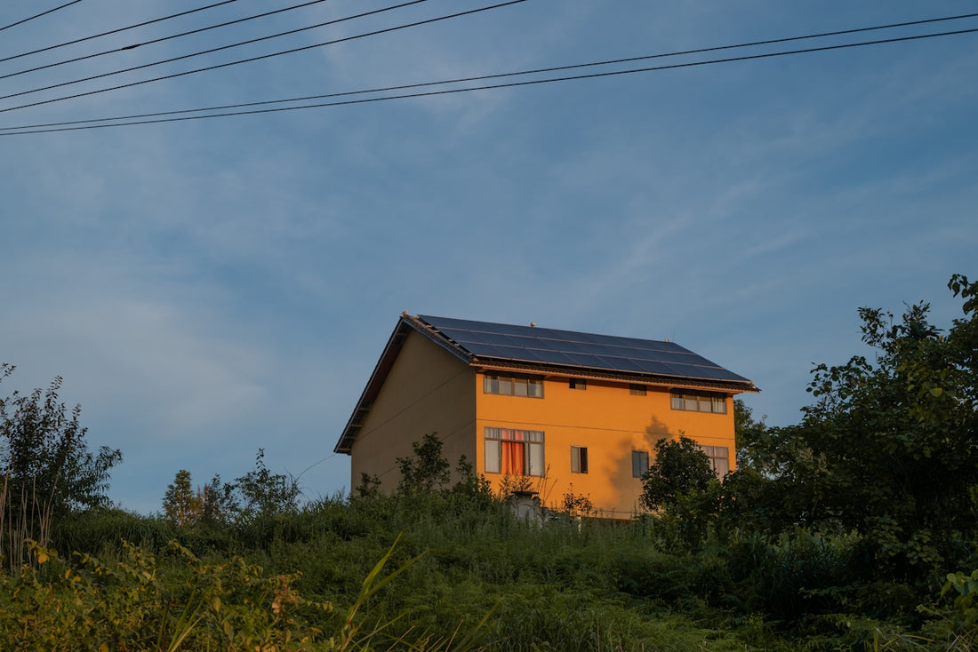 A house with a solar panel on the roof