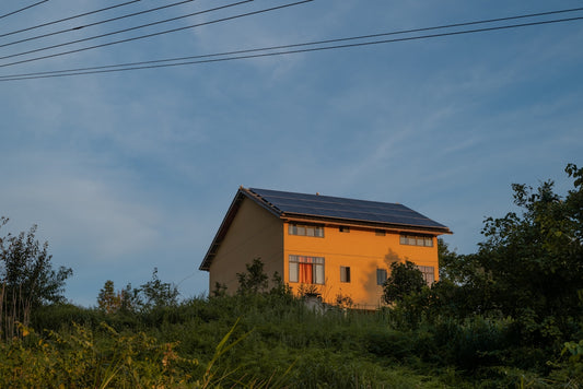 A house with a solar panel on the roof
