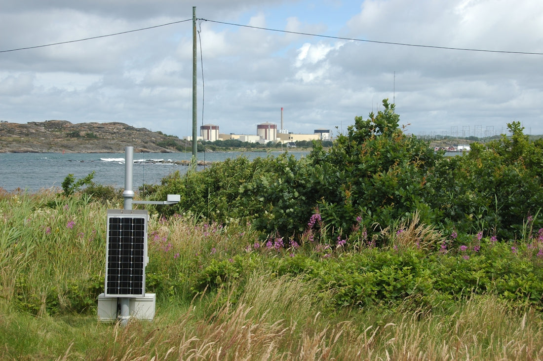 A solar panel in the middle of a field