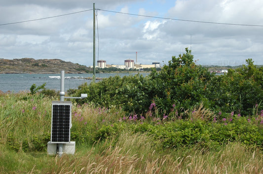 A solar panel in the middle of a field