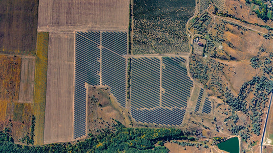 Aerial view of a large solar panel farm.
