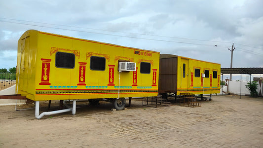a couple of yellow and black trailers