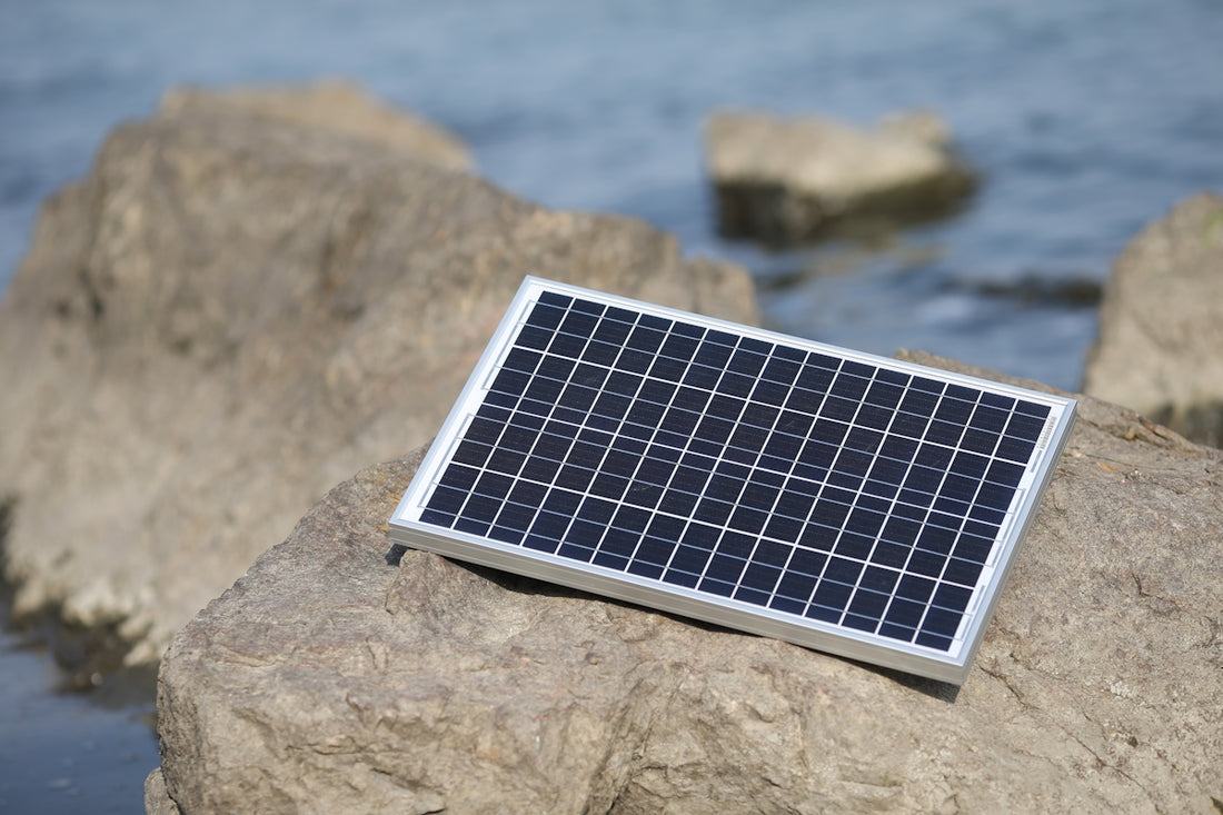 a solar panel on a rock