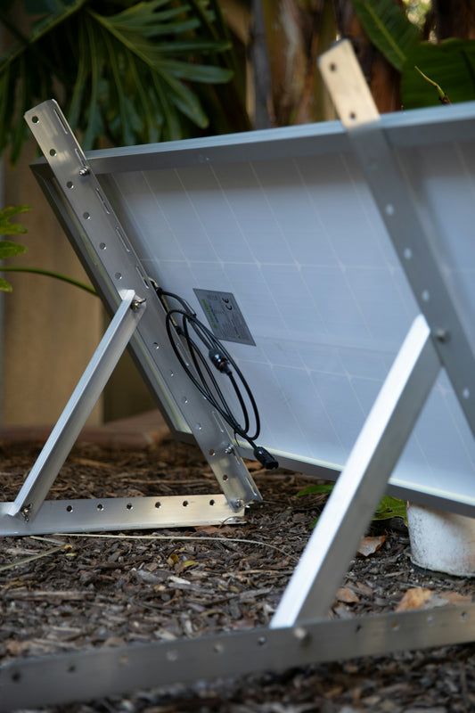 a solar panel sitting on top of a metal stand