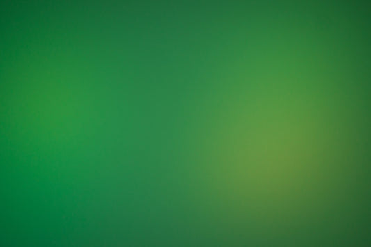 a blurry green background with a white border
