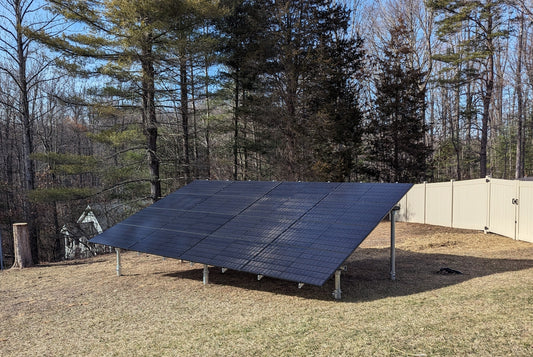 a large solar panel sitting in the middle of a field