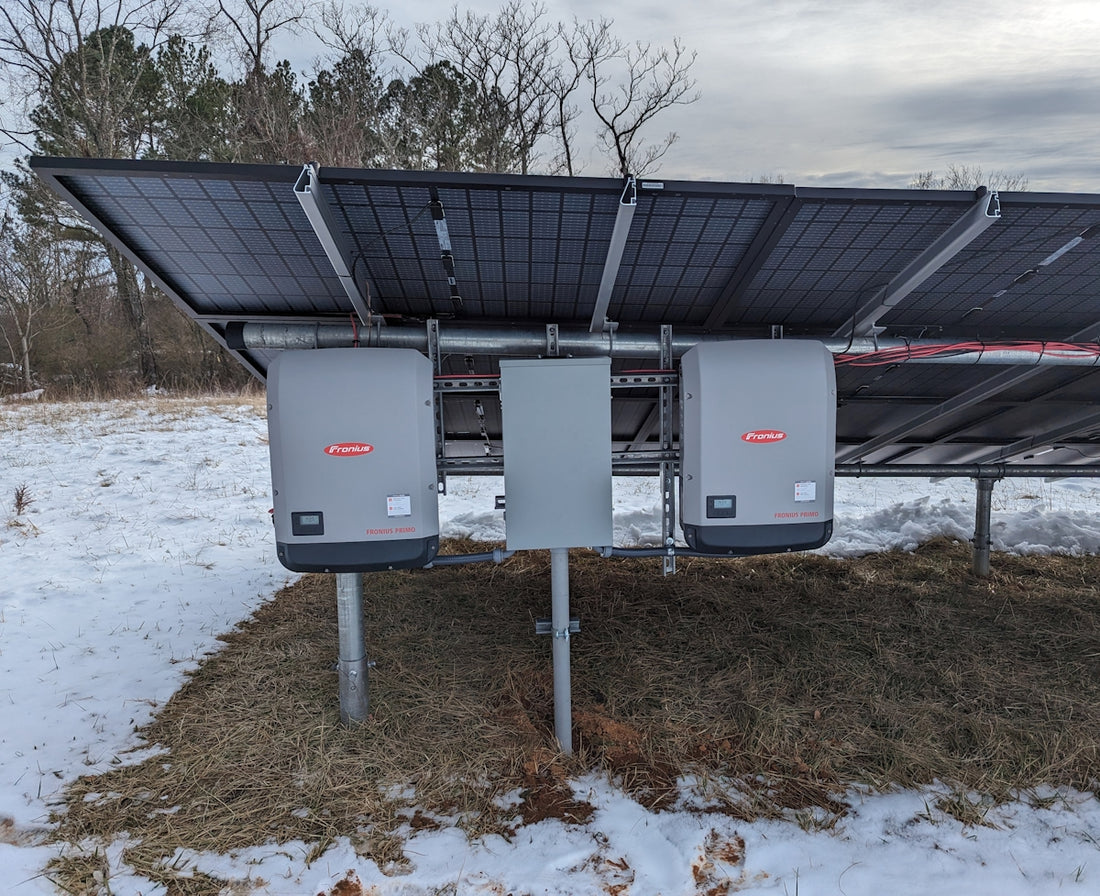 a solar panel attached to a pole in the snow