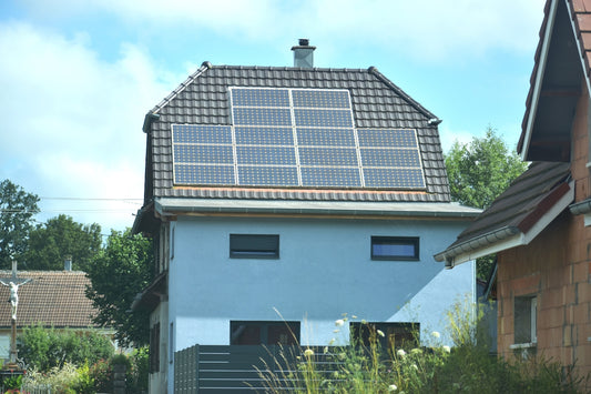 A house with a solar panel on the roof