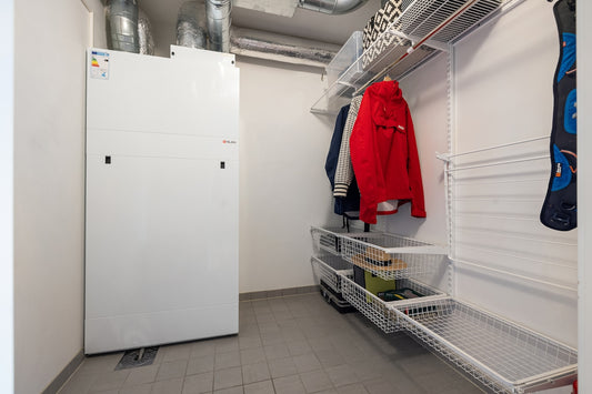 A white refrigerator freezer sitting inside of a kitchen