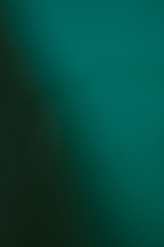 Dark teal and green gradient background